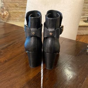 Kate Spade black heeled booties with strap and buckle.